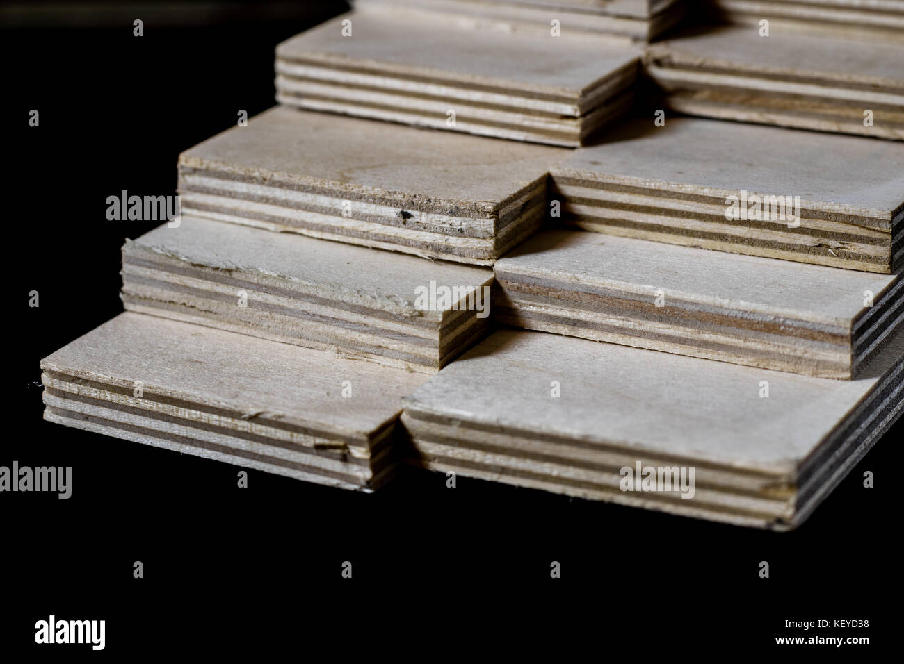 Freshly cut plywood. Plywood strips arranged in stacks. Warehouse with