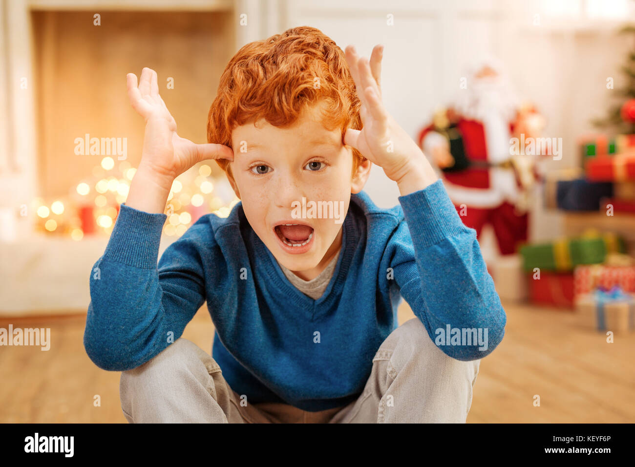Amazed ginger child cannot believe his eyes Stock Photo