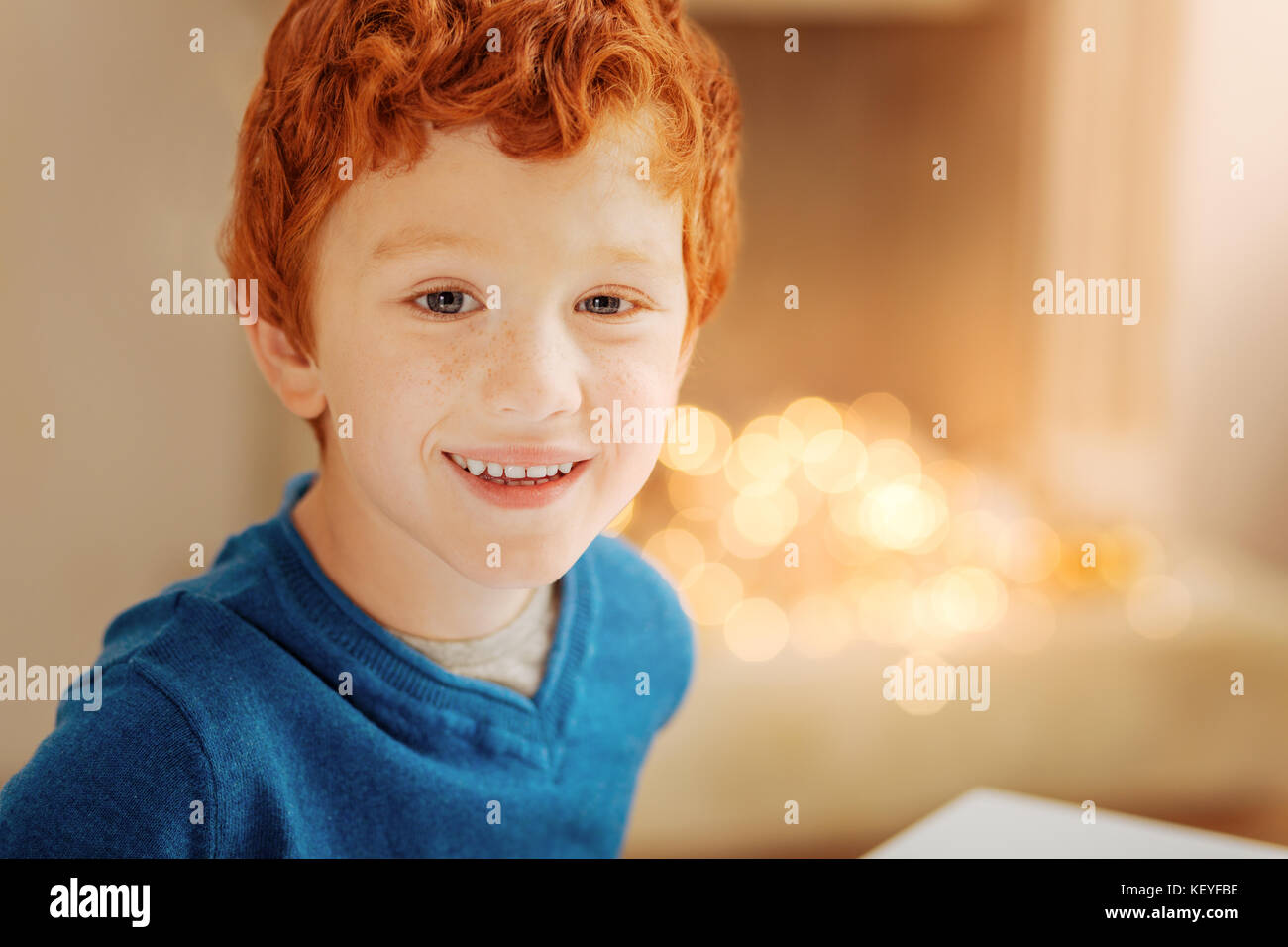 Adorable redhead kid grinning broadly into camera Stock Photo Alamy