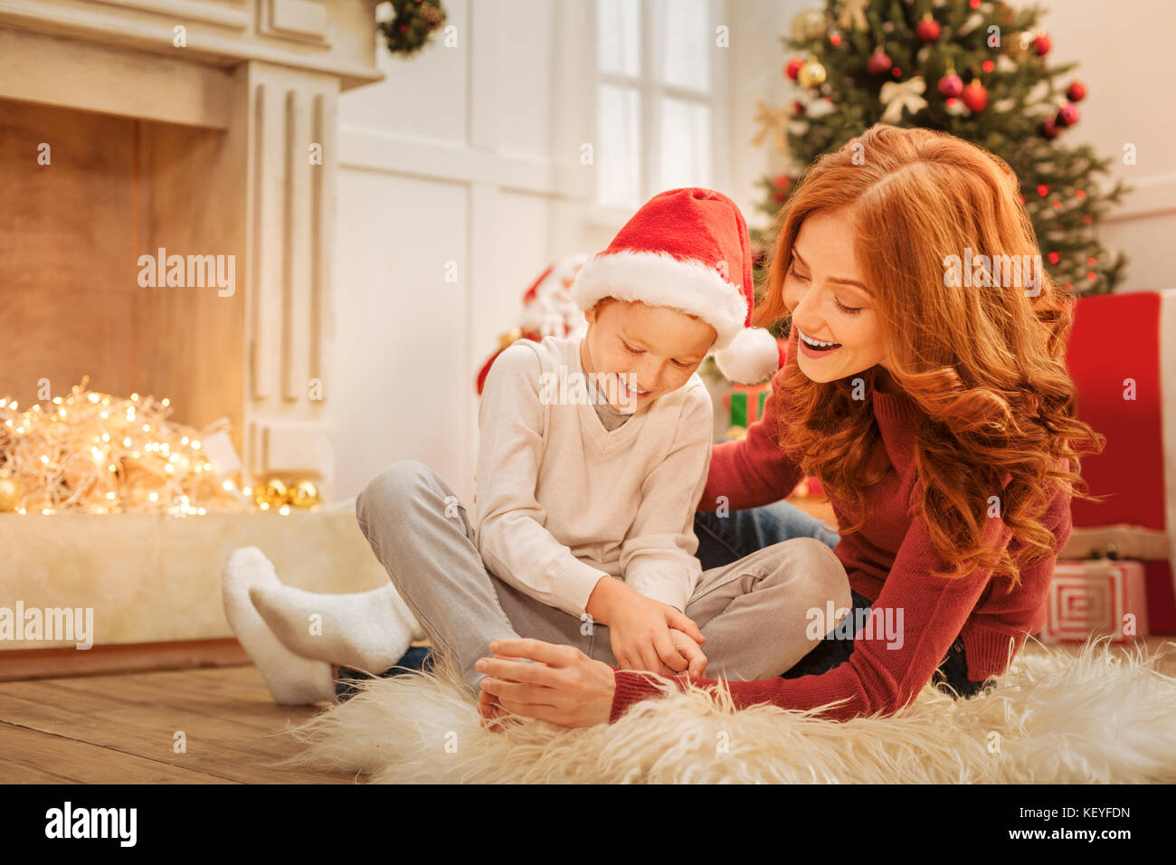 Radiant mother and son having pleasant conversation Stock Photo