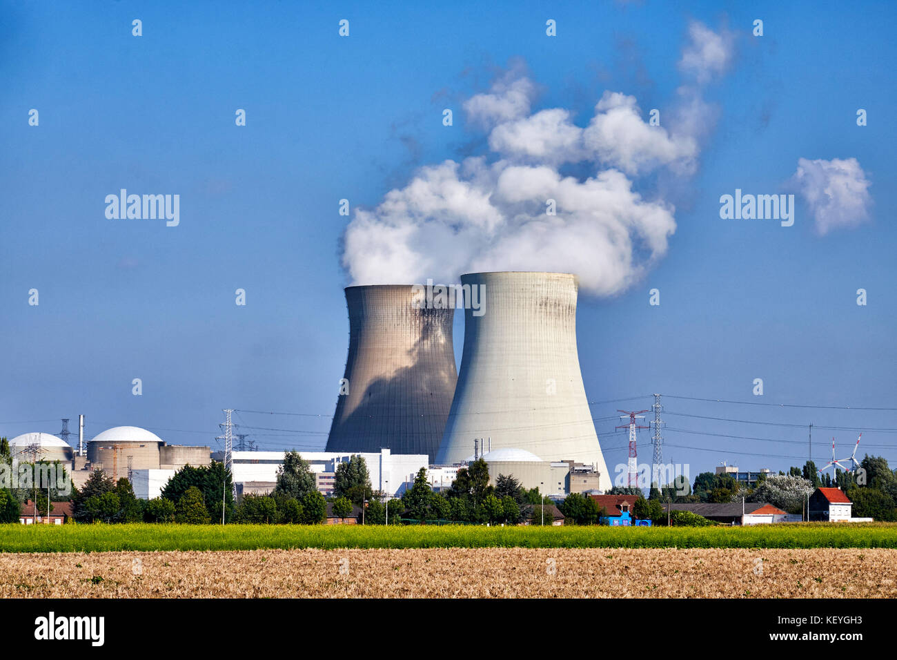 Steam rising from the two cooling towers of the  Nuclear Power Plant at the small village if Doel in Flanders, Belgium very close to the Dutch border Stock Photo