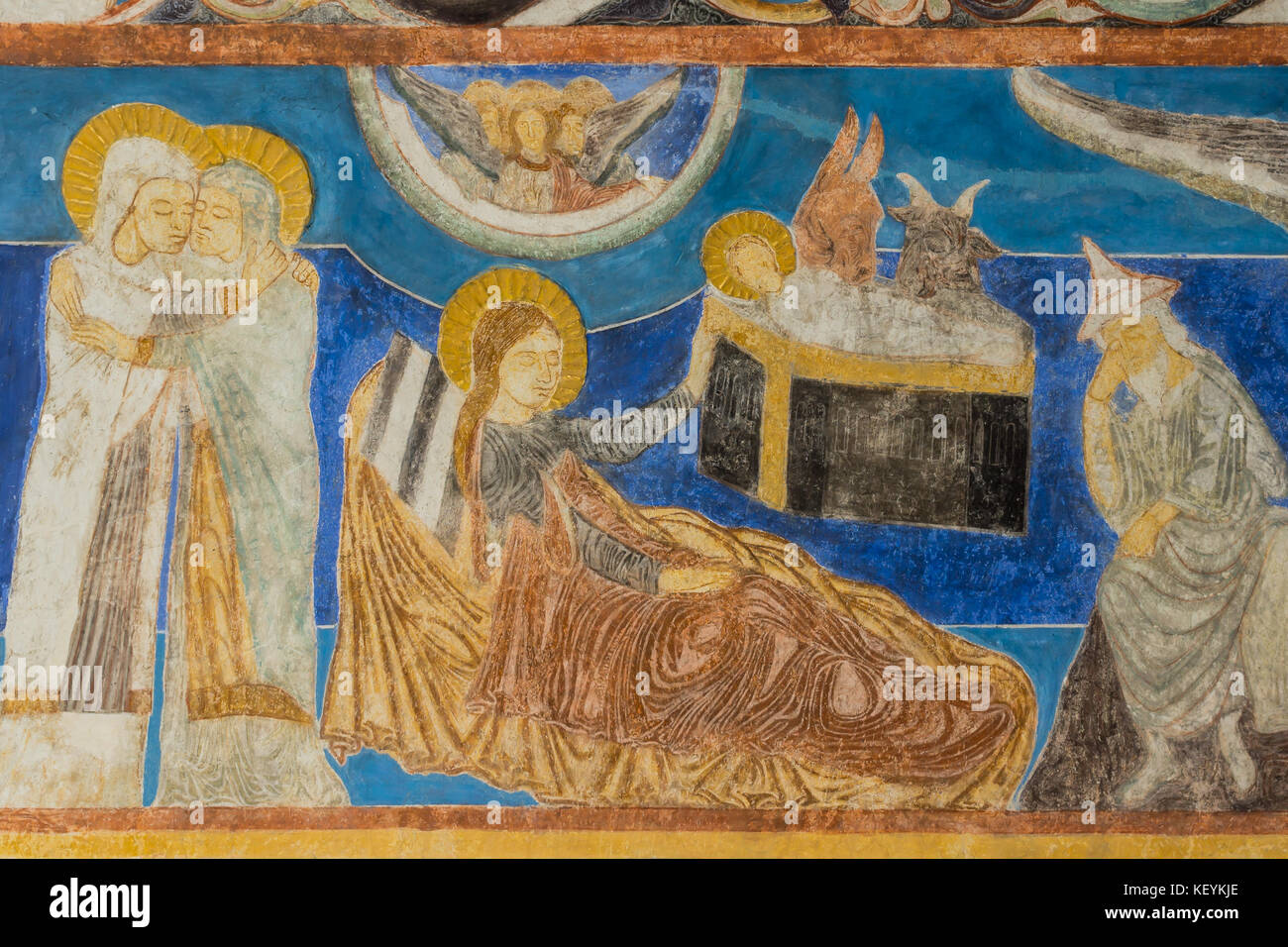 Mary visits Elisabeth. The birth in the stable, Christmas fresco in a medieval church. Bjaresjo, Sweden, September 4, 2014 Stock Photo