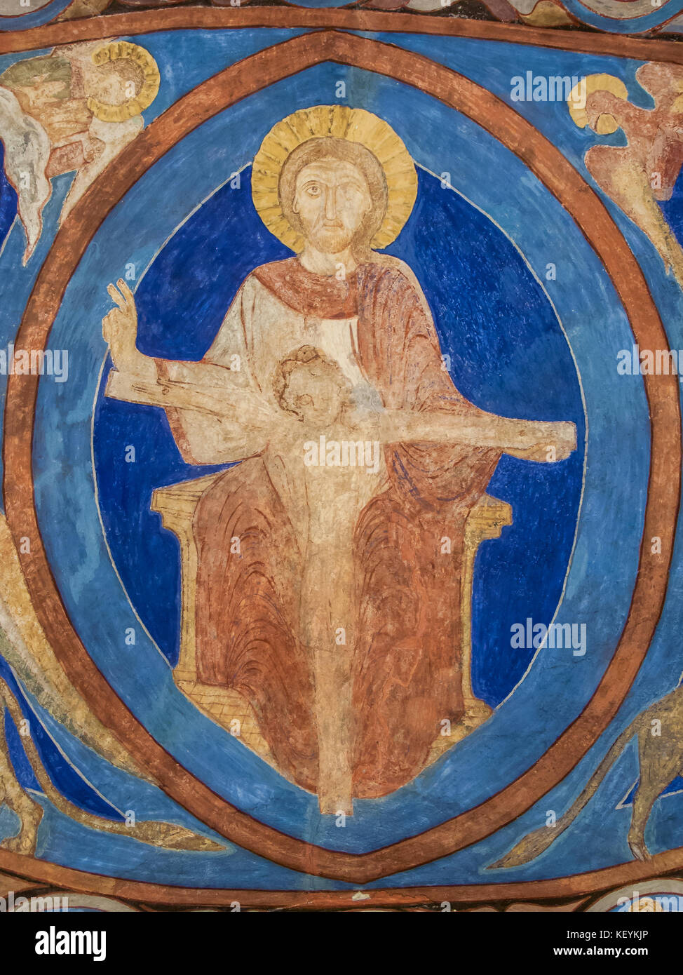 God Father holding Christ on the cross, a romanesque wall-painting in Bjaresjo church, Sweden, November 6, 2009 Stock Photo