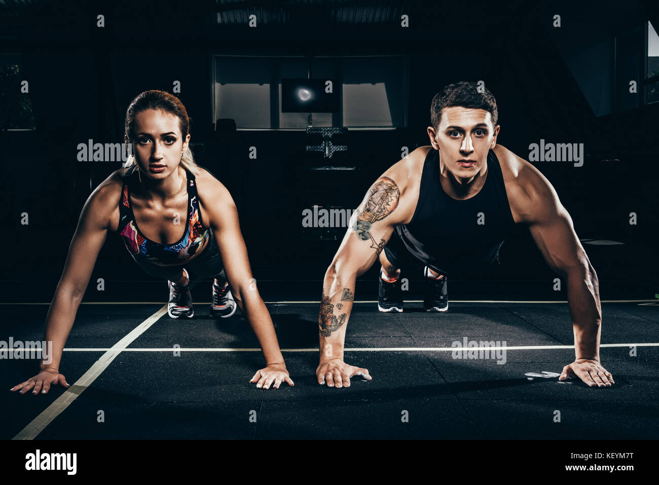 Fit couple doing push ups Stock Photo