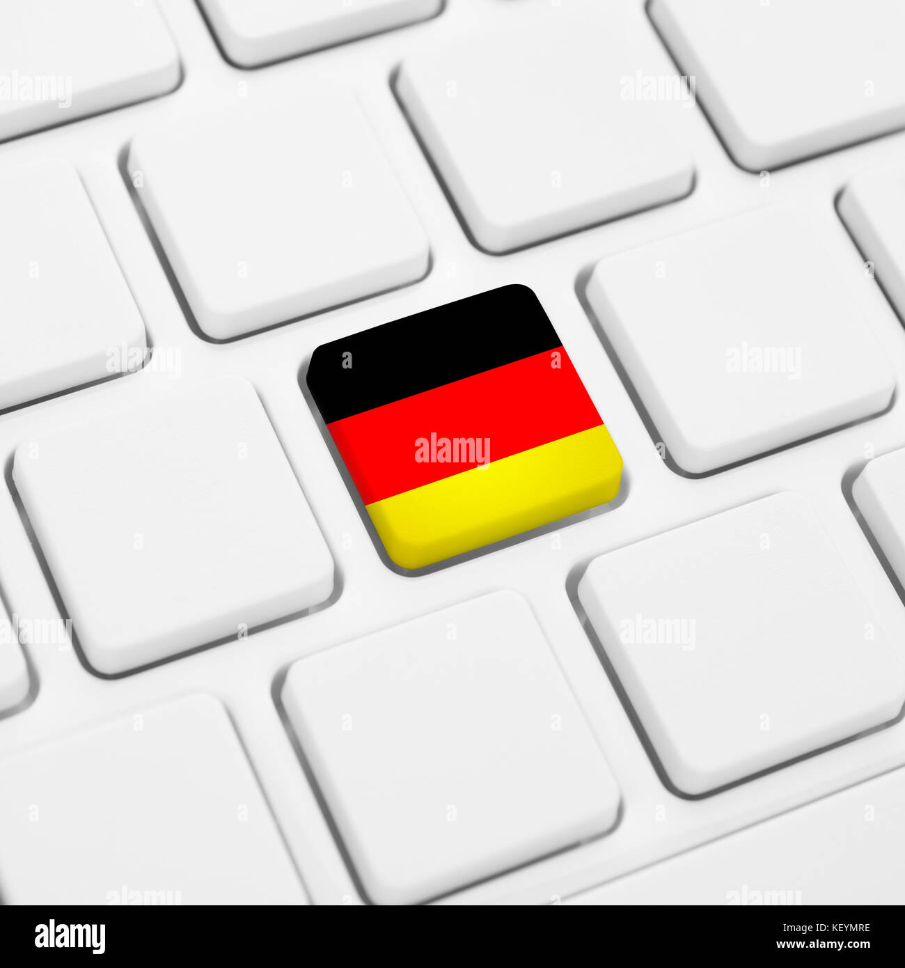 German language or Germany web concept. National flag button or key on white keyboard Stock Photo
