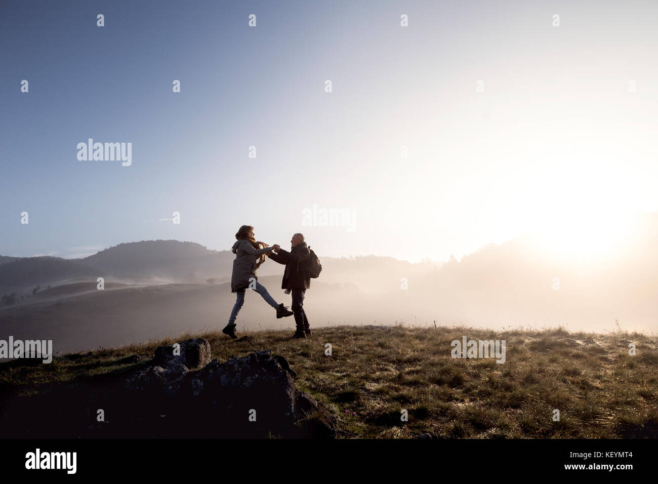 Active senior couple on a walk in a beautiful autumn nature Stock Photo ...