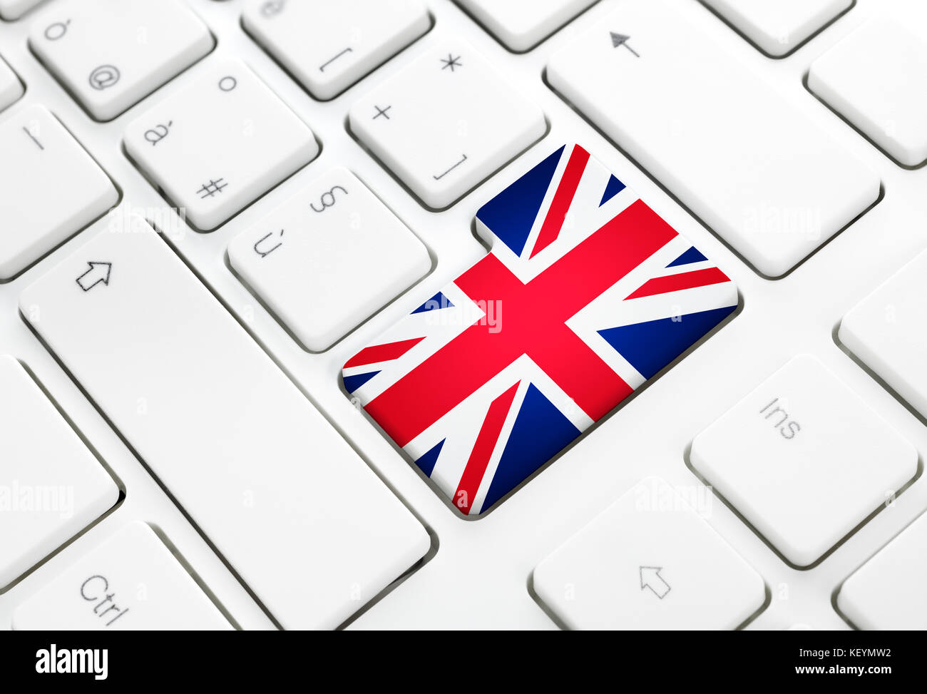 English language or UK web concept. United Kingdom flag enter button or key on white keyboard Stock Photo