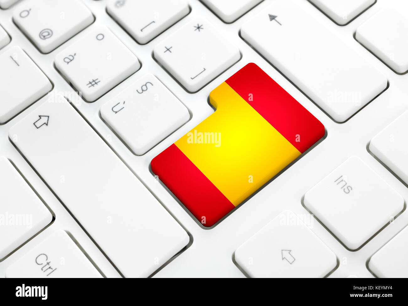 Spanish language or spain web concept. National flag enter button or key on white keyboard Stock Photo