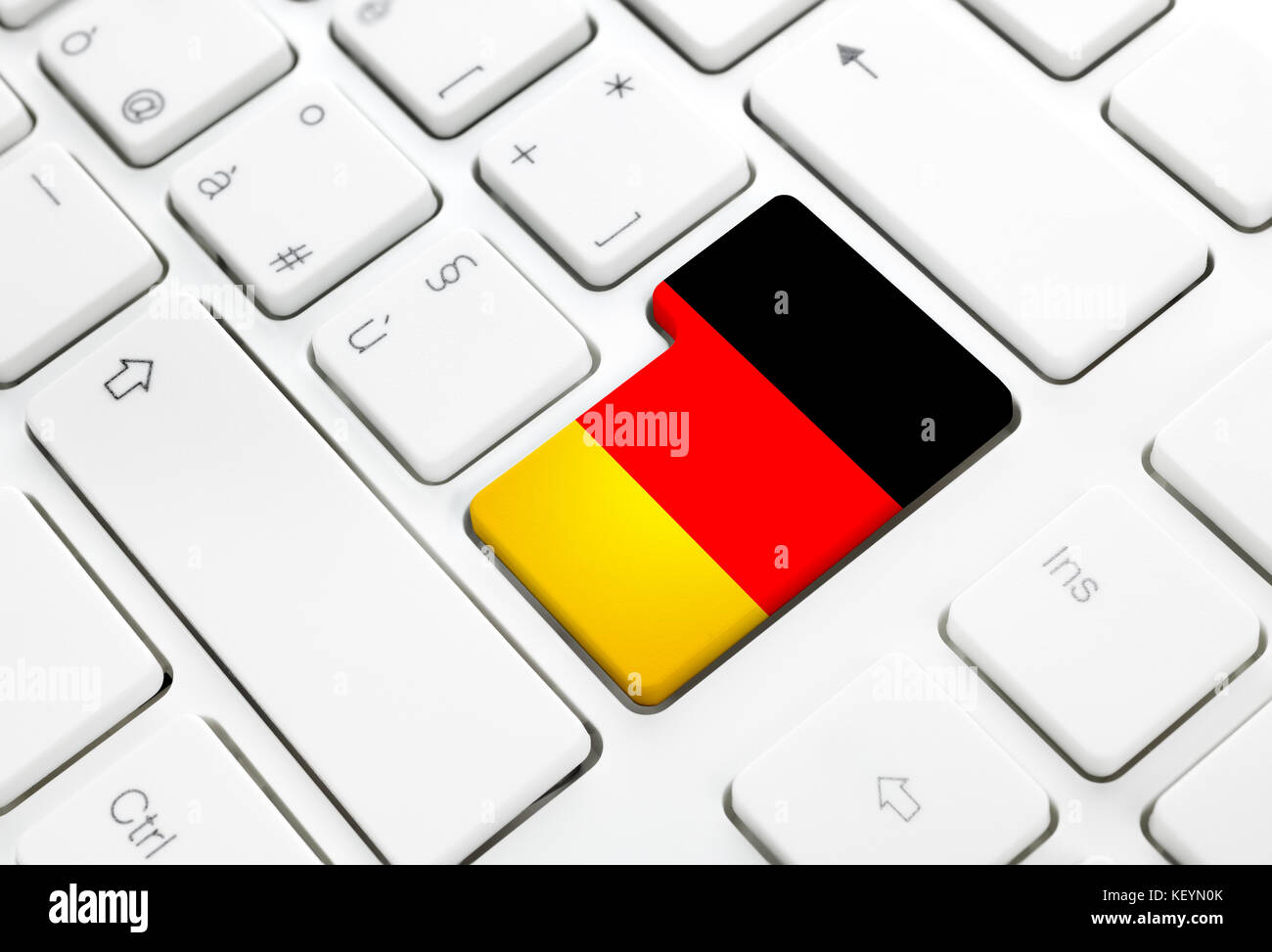 German language or Germany web concept. National flag enter button or key on white keyboard Stock Photo