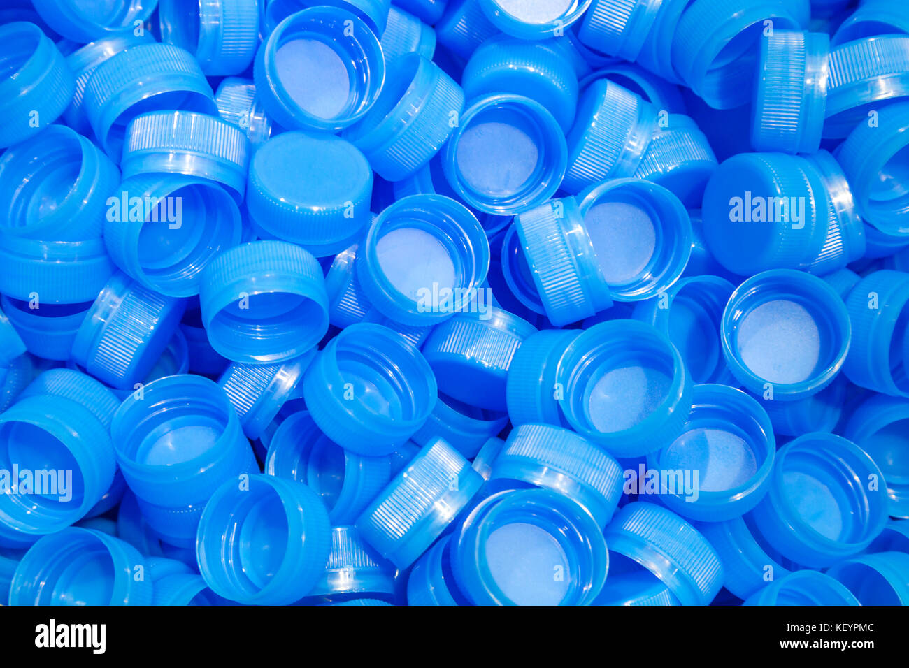 group of plastic bottle caps are ready to send to production line in
