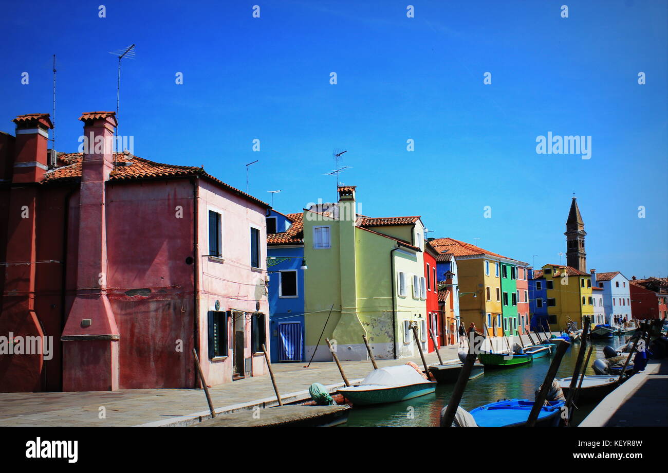 Street with colorful buildings in Burano island, Venice, Italy Stock Photo