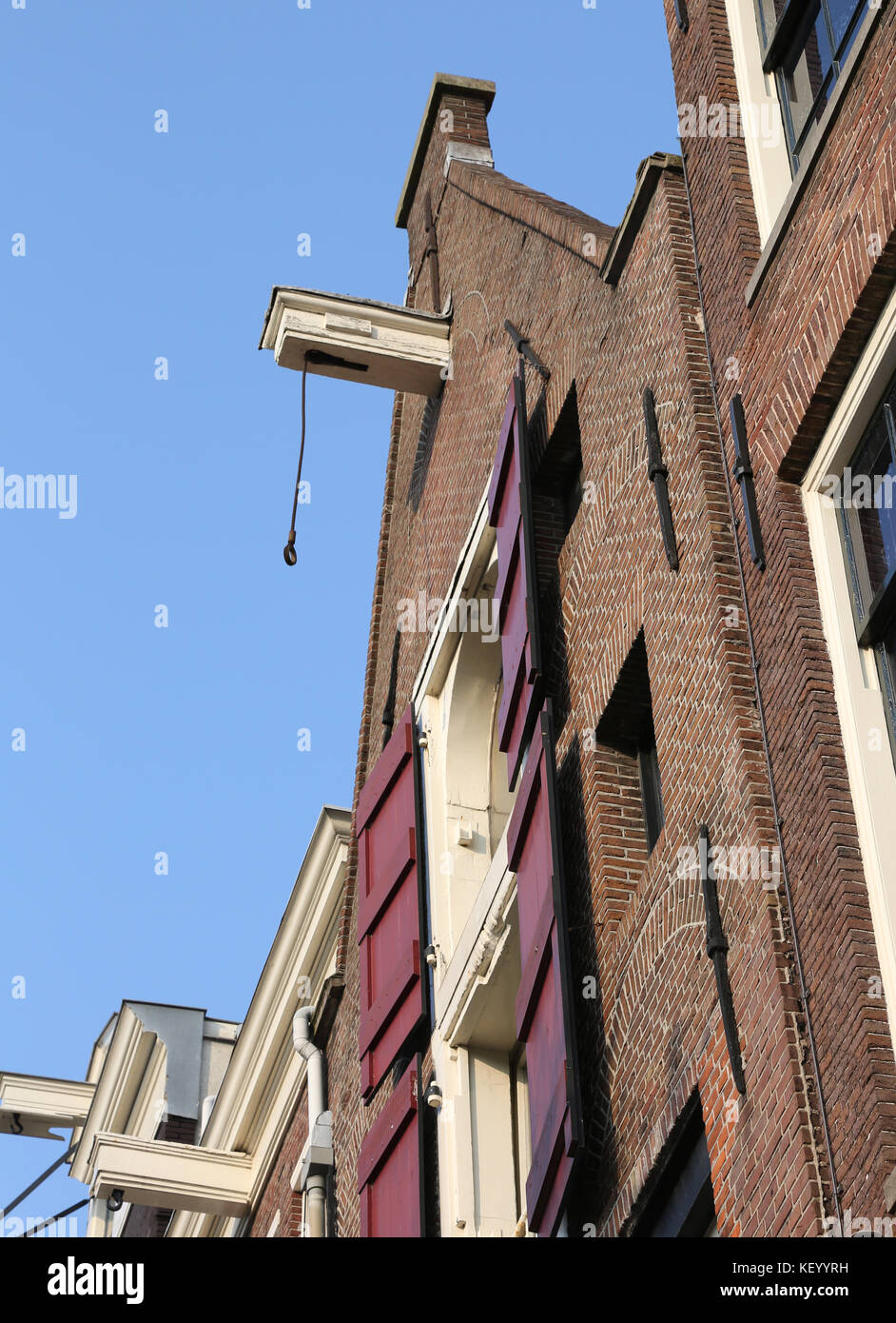 typical amsterdam house with big hook near the roof to carry the