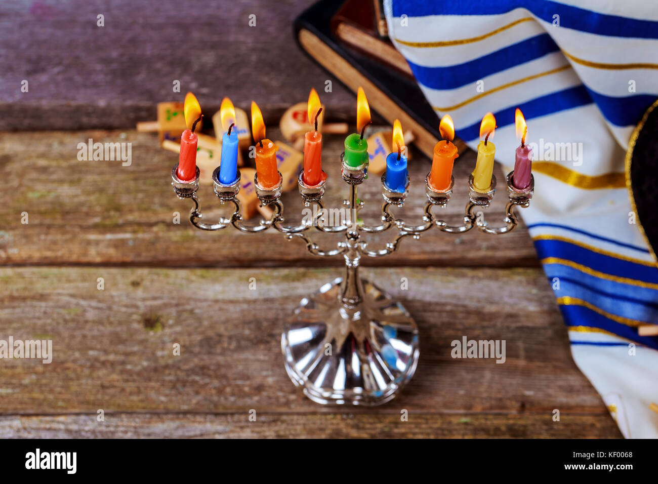 Jewish holiday hannukah prayer shawl, jewish cap and nine candle