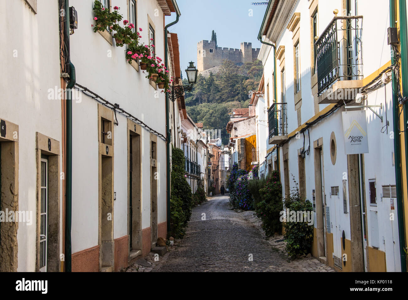 Narrow street in old town beneath the Convent of Christ, Tomar, Ribatejo Province, Portugal Stock Photo