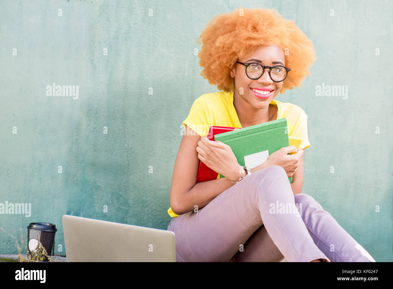 African student using laptop outdoors hi-res stock photography and ...