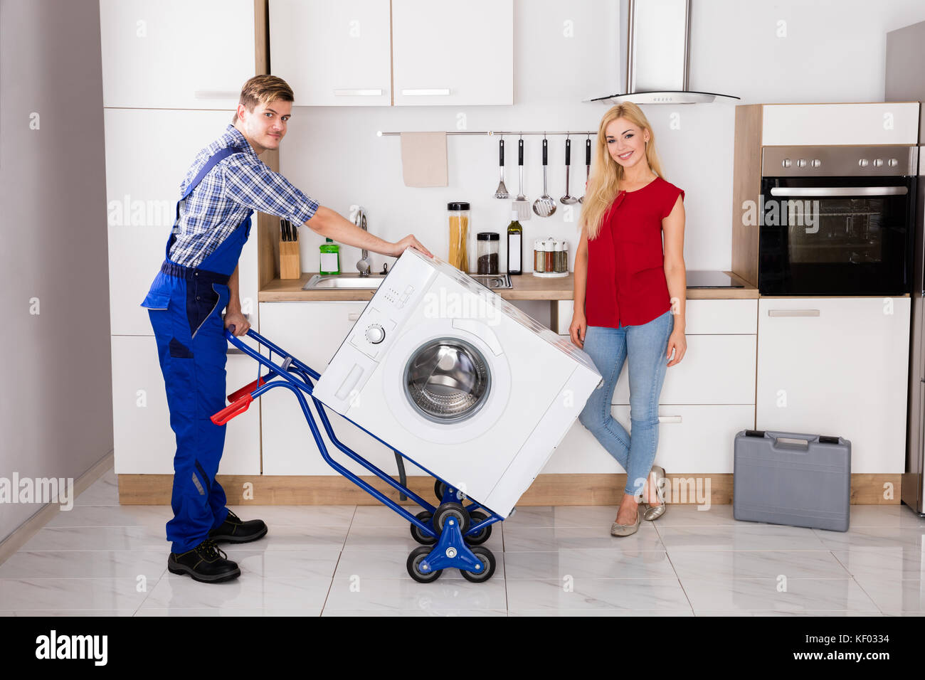 Carrying washing machine hires stock photography and images Alamy