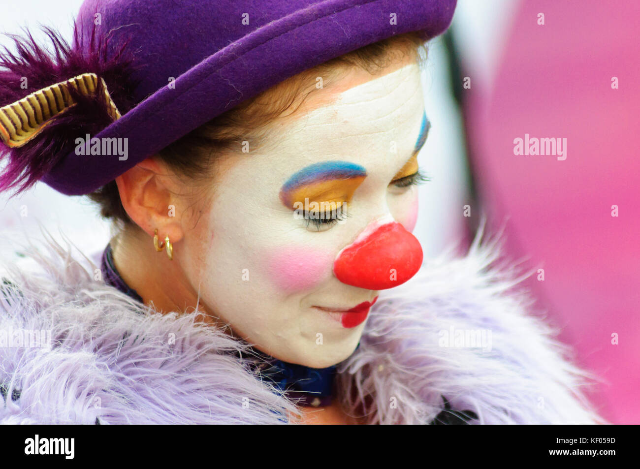 Female mime artist with painted face and costume performs on the high ...