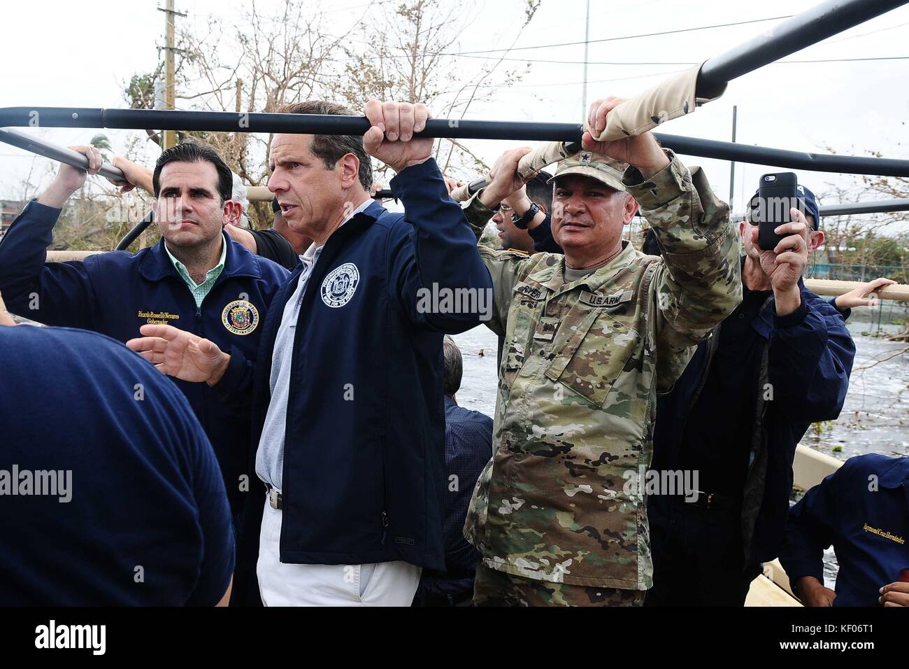 Puerto Rican Governor Ricardo Rossello Nevares (left), New York Governor Andrew Cuomo, and Puerto Rican Adjutant General Isabelo Rivera visit the flooded communities of Condado and Isla Verde in the aftermath of Hurricane Maria September 27, 2017 in San Juan, Puerto Rico. Stock Photo