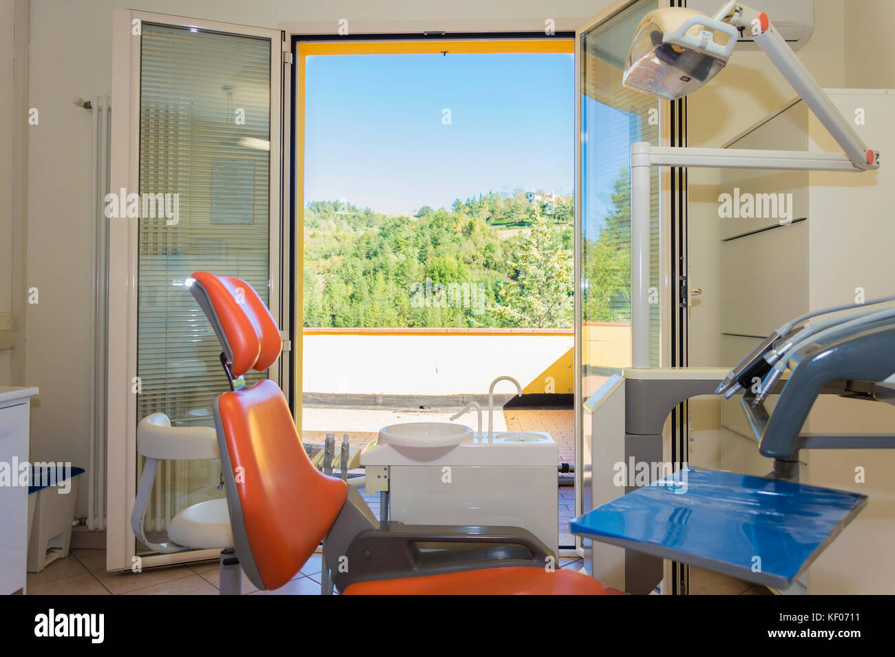 Modern dental practice. Dental chair and other accessories used by dentists Stock Photo