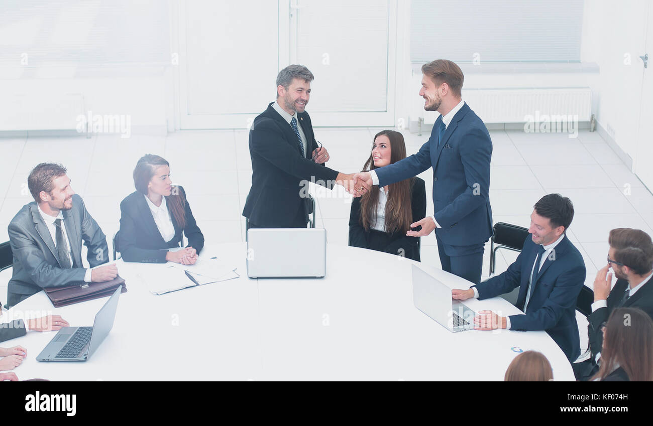 business partners shaking hands after a successful transaction ...