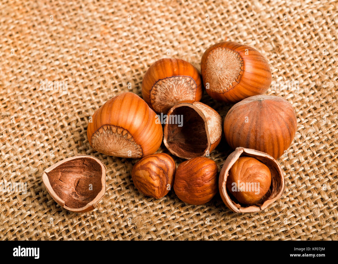 Group of nuts on jute background Stock Photo