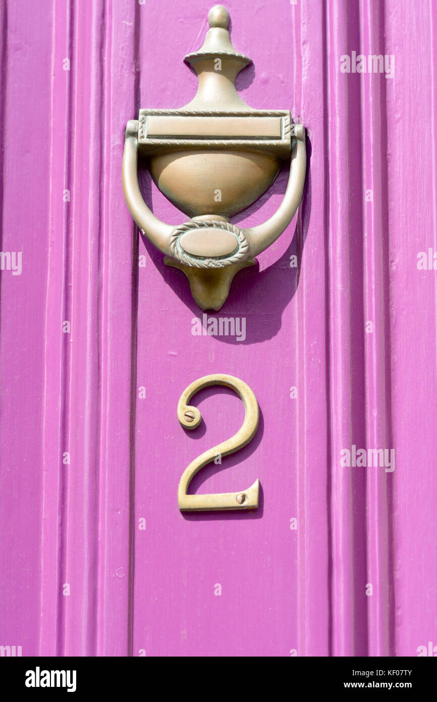 Pink door brass door knocker hi-res stock photography and images - Alamy