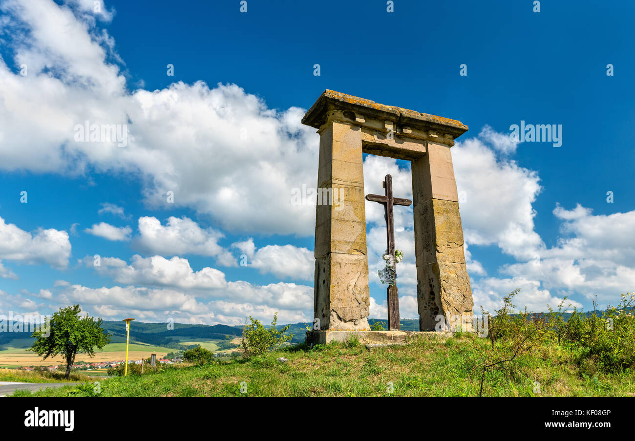Christian cross in a field on the border between Presov and Kosice regions in Slovakia Stock Photo