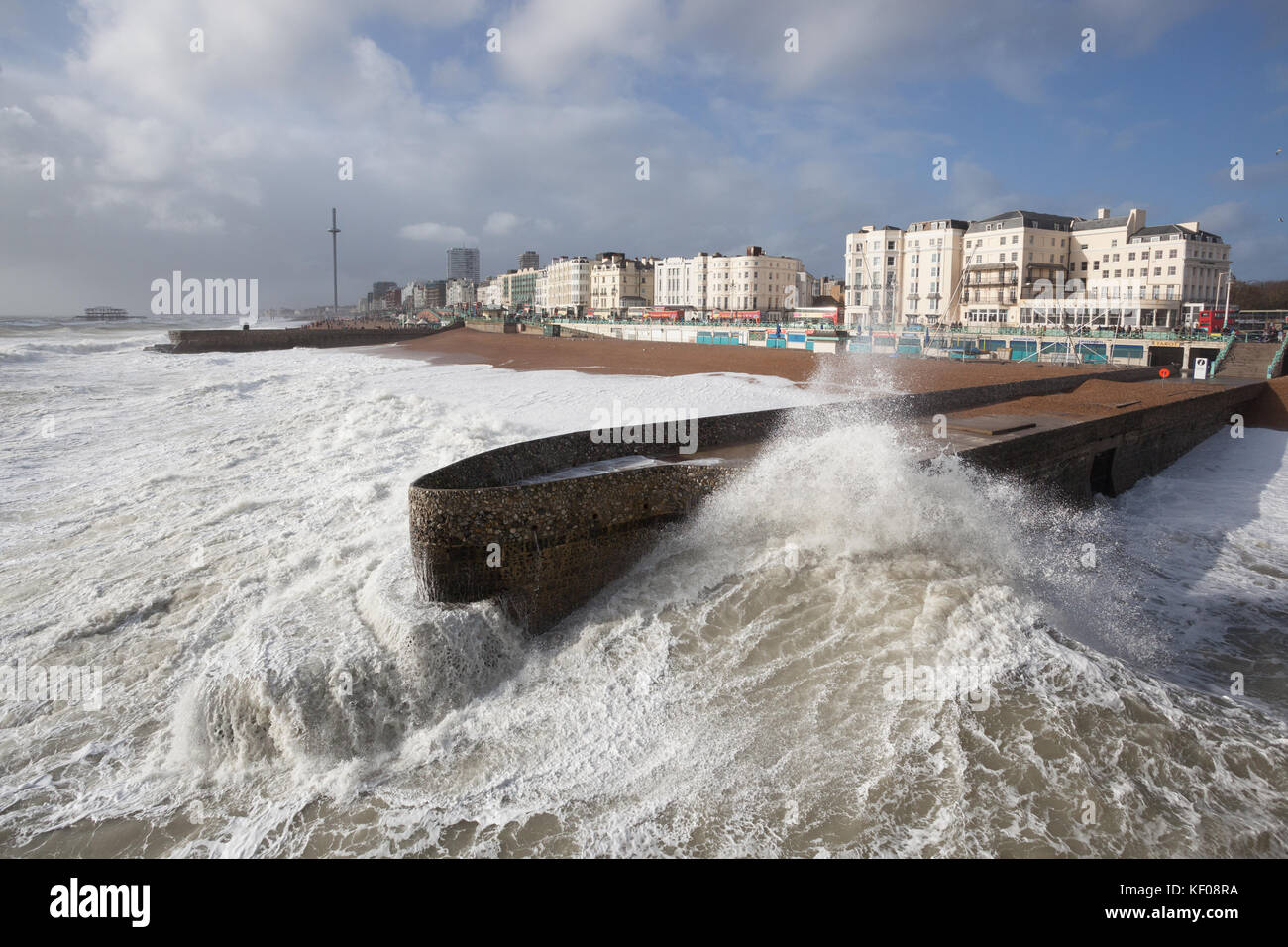 Brighton seafront - waves crashing on groyne on a stormy day. (Storm Brian) Stock Photo