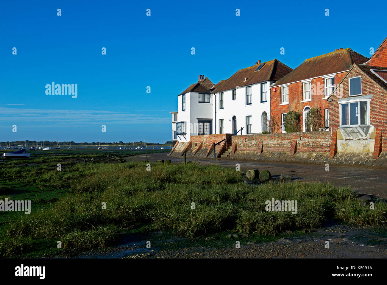 Houses with flood defenses, Bosham, West Sussex, England UK Stock Photo