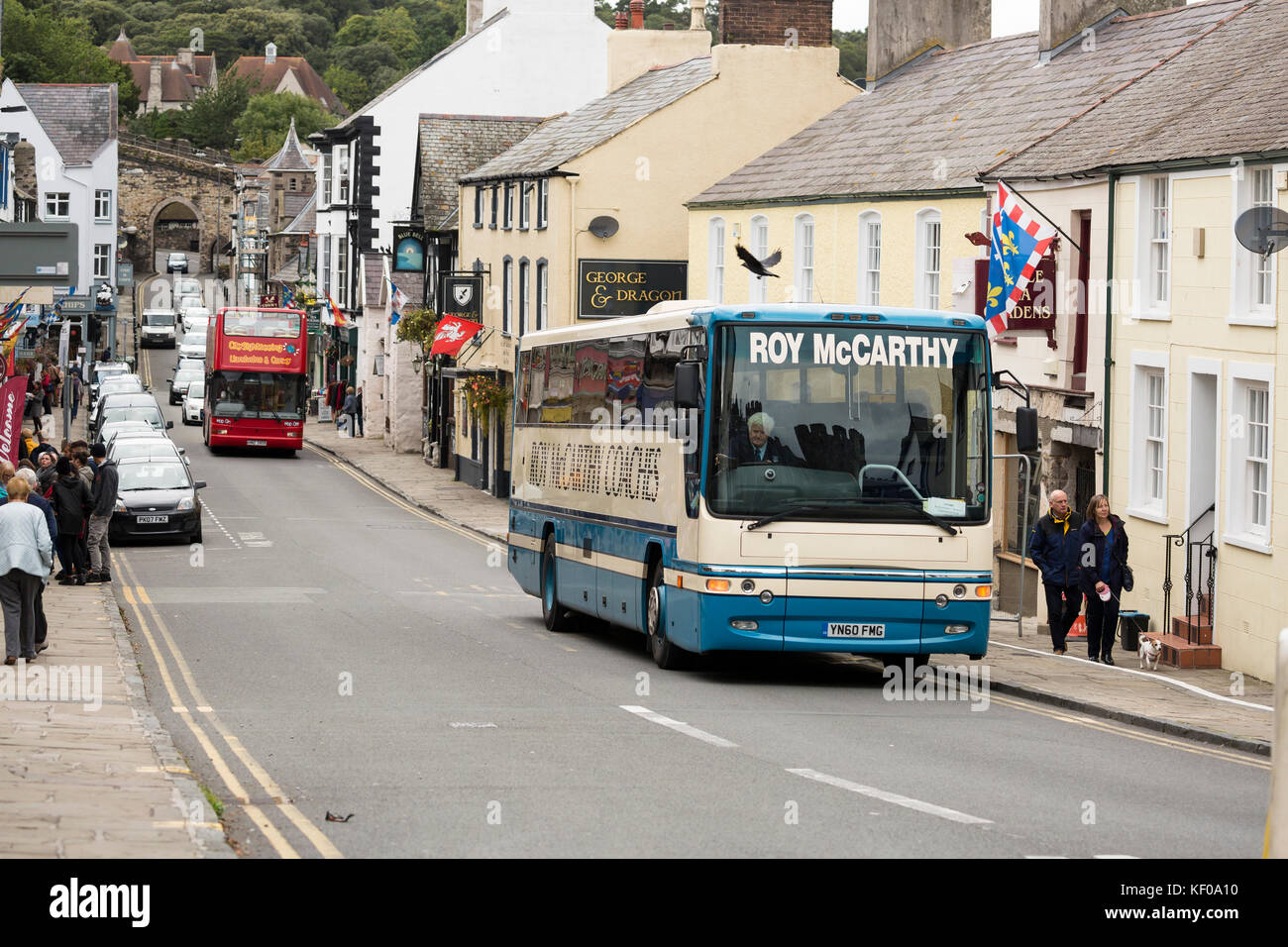 Conwy town high street scene with buses Stock Photo