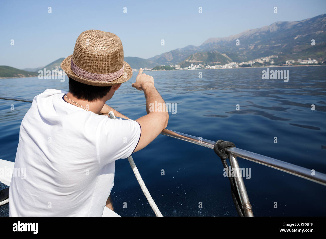man aboard a boat looking at the sea Stock Photo - Alamy