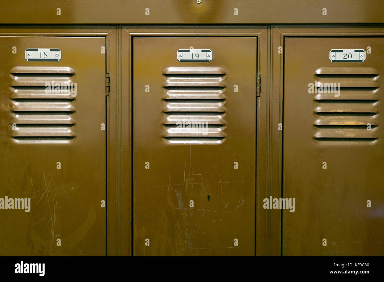 A close up of steel storage locker cupboards showing the locker room