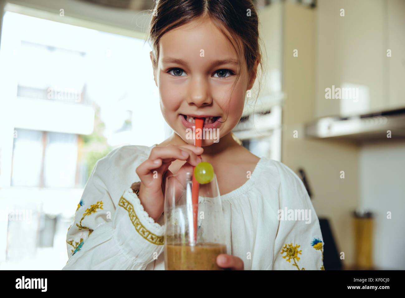 Girl enjoying her homemade smoothie Stock Photo