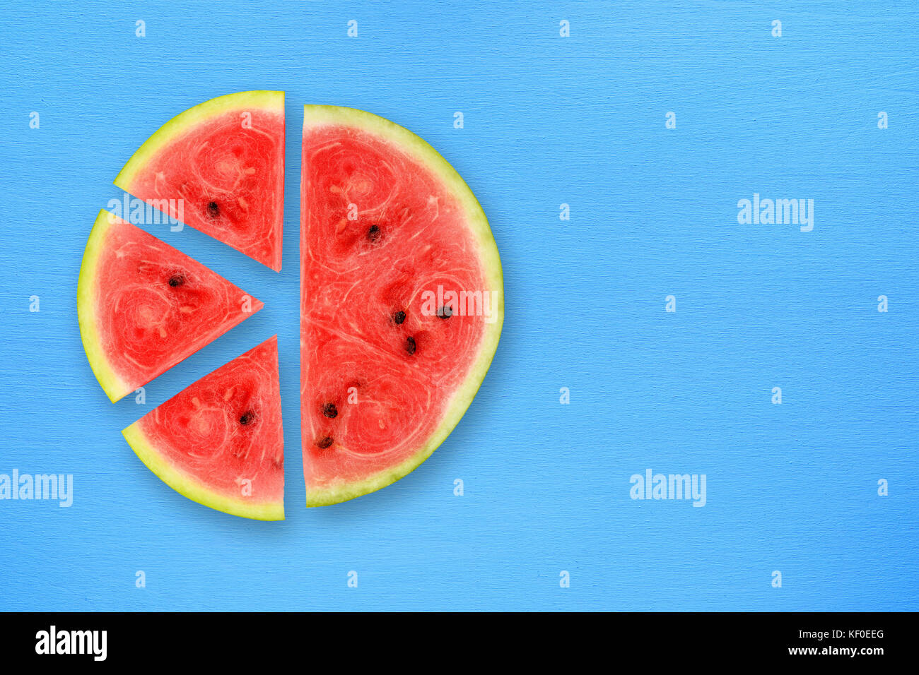 Watermelon slices on blue table top view Stock Photo - Alamy