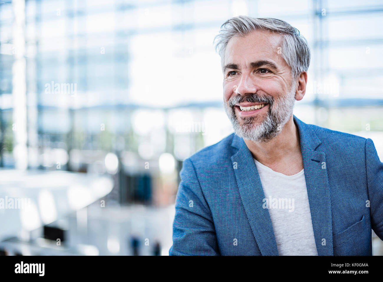 Portrait of smiling businessman Stock Photo - Alamy