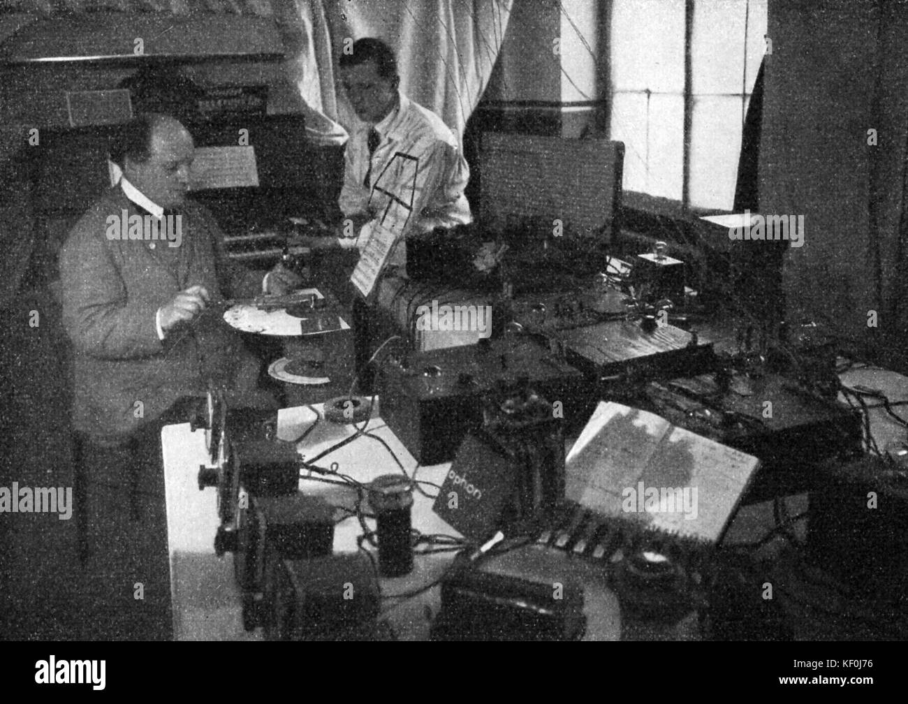 Jorg Mager and assistant with the Spharophon. An electrical musical instrument that was first made as the 'Electrophon' c. 1921 by Jörg Mager and modified in 1926 version shown here used a radio frequency oscillator. Stock Photo