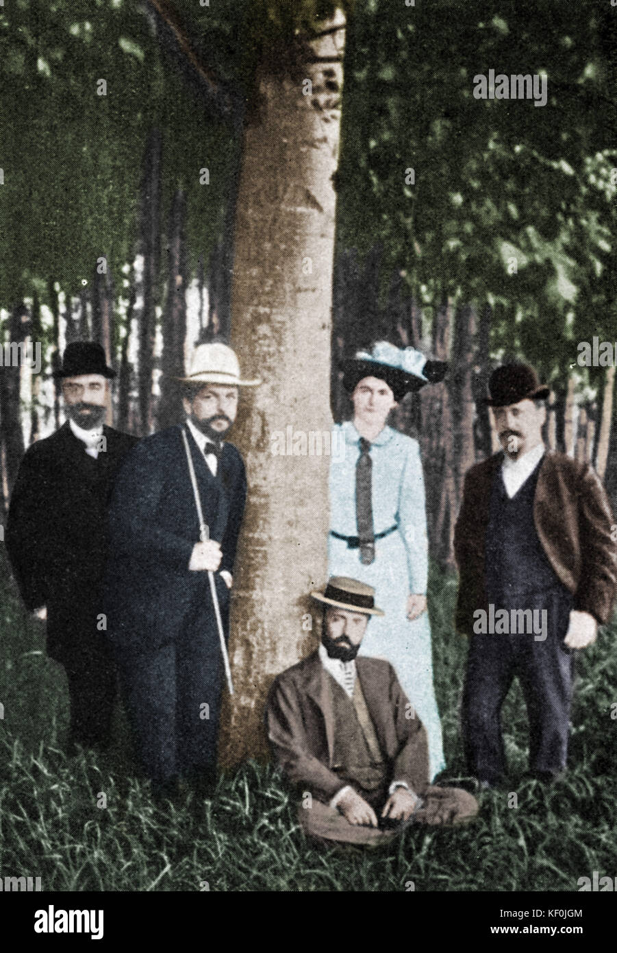 Claude Debussy and other composers at Eragny, 1902.    From l. to r.: Paul Poujaud, Debussy, Pierre Lalo, Lily Debussy, Paul Dukas. Colourised version. French composer, 22 August 1862 - 25 March 1918. Stock Photo