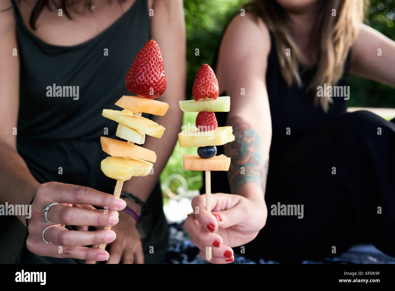 Uk, London, Hampstead Heath Park, detail of fruit sticks, friends picnic at the park in summer Stock Photo