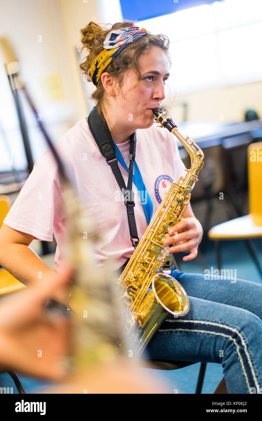 Music Education : Young women playing saxophone in the jazz music workshop class at  MusicFest Aberystwyth July 2017 Stock Photo