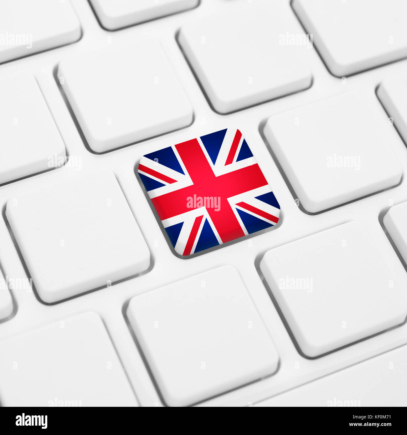 English language or UK web concept. United Kingdom flag button or key on white keyboard Stock Photo
