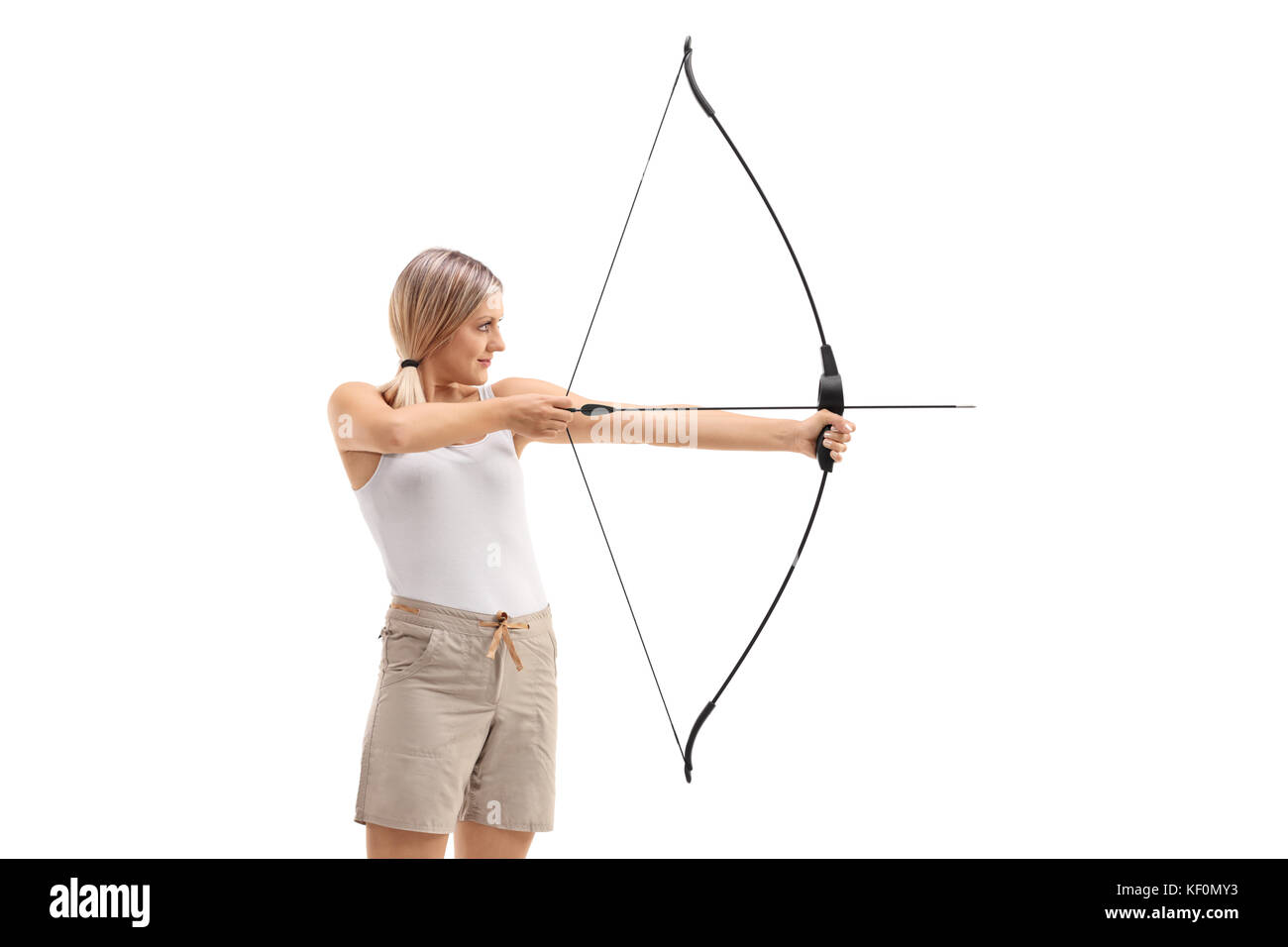 Young woman aiminig with a bow and arrow isolated on white background Stock Photo