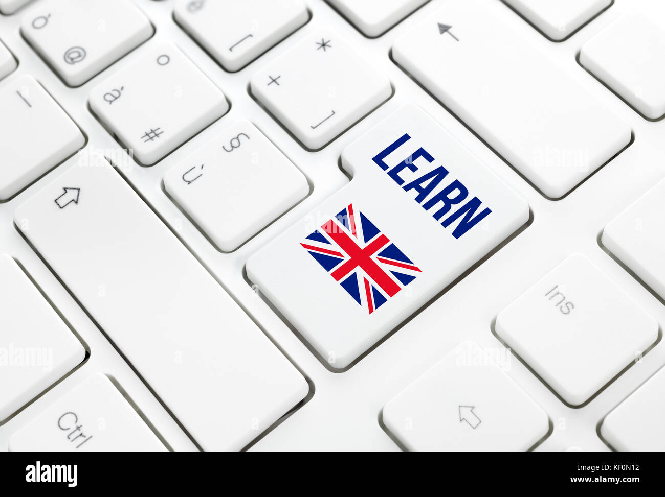 Learn English language education web concept. United Kingdom flag enter button or key on white keyboard Stock Photo