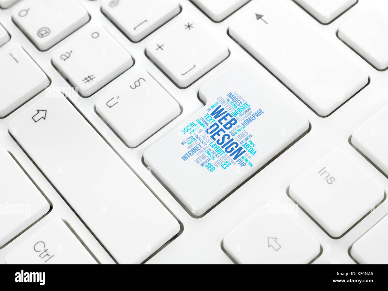 Web Design business concept word cloud  in enter button or key on white keyboard Stock Photo