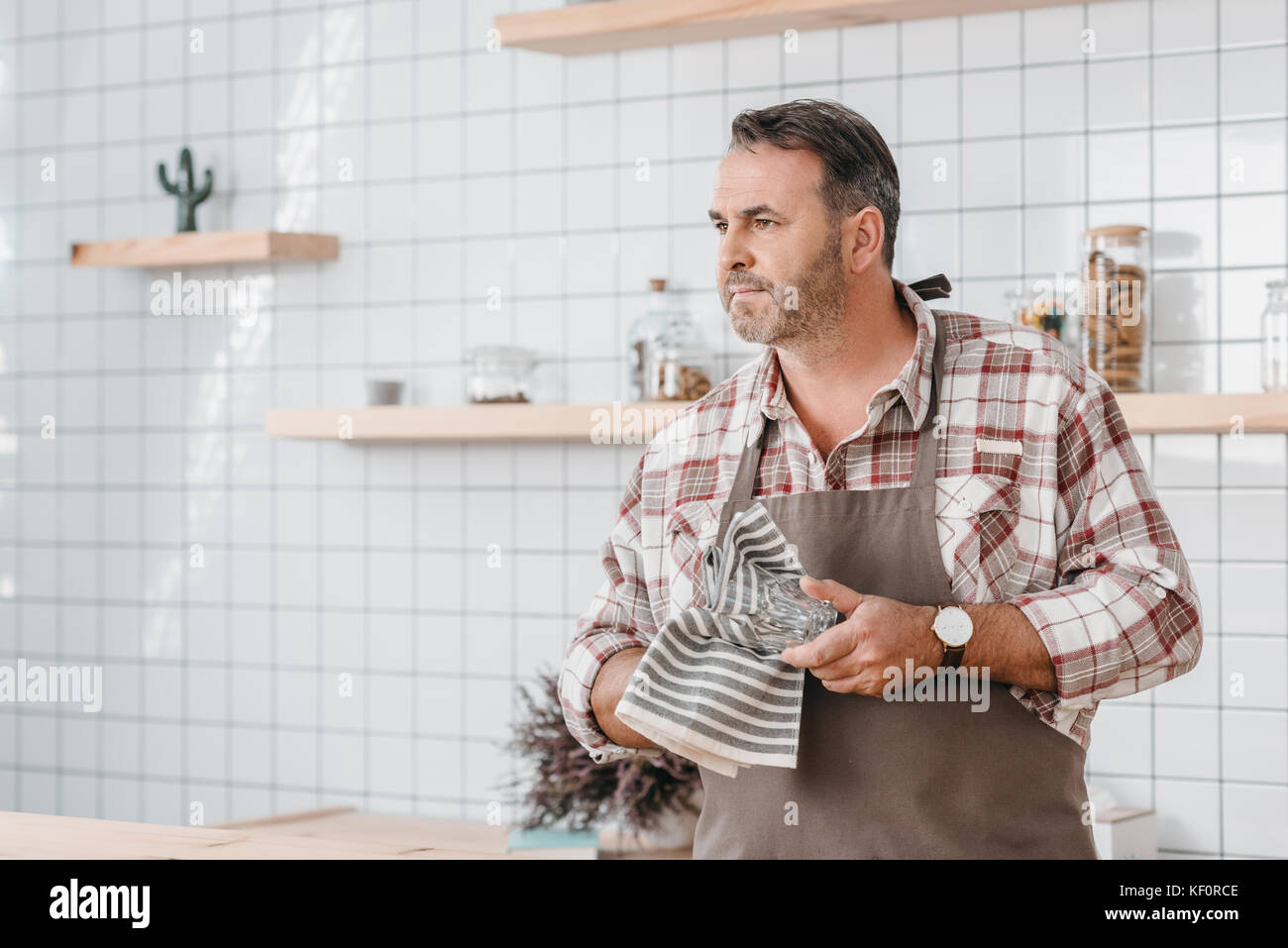 bartender wiping glass Stock Photo