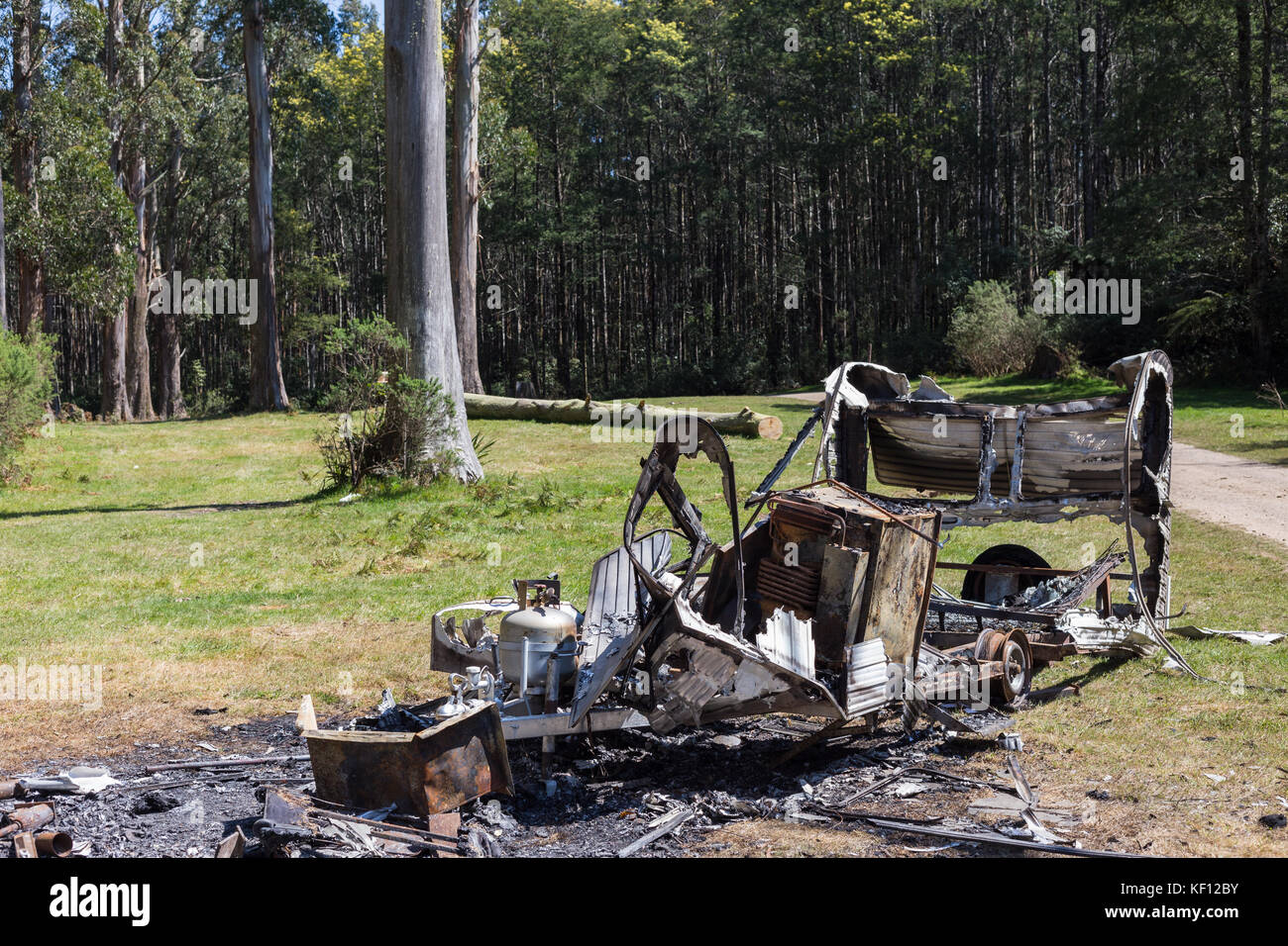 Burnt garbage in the nature causing environmental pollution Stock Photo