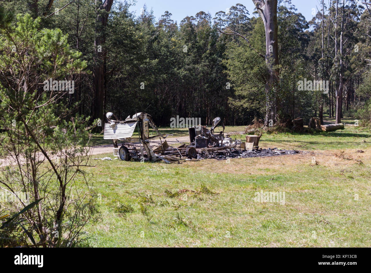 Burnt garbage in the nature causing environmental pollution Stock Photo