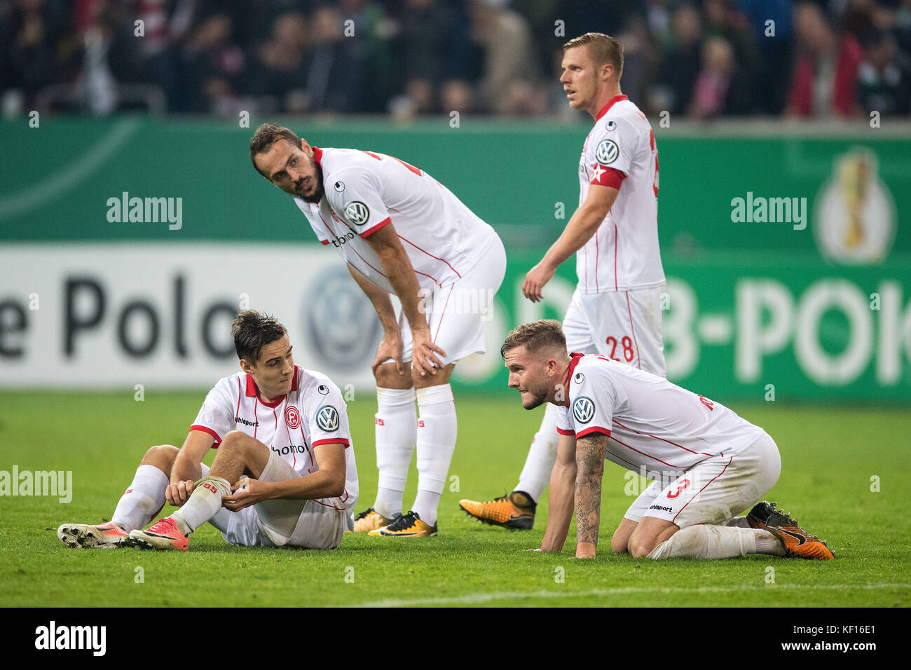 Dusseldorf's Florian Neuhaus (left to right), Emir Kujovic, Rouwen Hennings and Andre Hoffmann disappointed after their 0:1 defeat at the DFB Cup soccer match between Fortuna Dosseldorf and Borussia Monchengladbach in Dusseldorf, Germany, 24 October 2017. (EMBARGO CONDITIONS - ATTENTION: The DFB prohibits the utilisation and publication of sequential pictures on the internet and other online media during the match (including half-time). ATTENTION: BLOCKING PERIOD! The DFB permits the further utilisation and publication of the pictures for mobile services (especially MMS) and for DVB-H and D Stock Photo