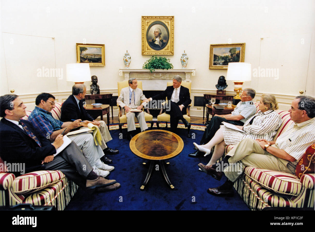 United States President Bill Clinton meets in the Oval Office on July 22, 1995 with (from left to right) CIA Deputy Director George Tenet; Chief of Staff Leon Panetta; National Security Advisor Anthony Lake; US Secretary of State Warren Christopher; Chairman of the Joint Chiefs of Staff General John Shalikashvili; US Ambassador to the United Nations Madeline Albright and US Deputy Secretary of Defense John White. Mandatory Credit: Robert McNeely/White House via CNP - NO WIRE SERVICE - Photo: Robert Mcneely/Consolidated News Photos/Robert McNeely - White House via CNP Stock Photo