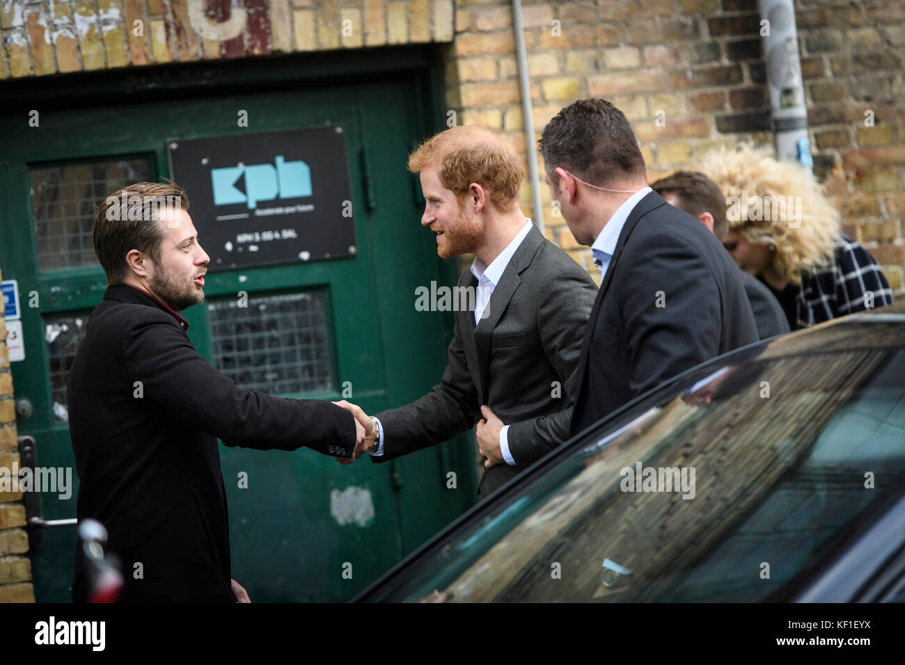 Copenhagen, Denmark. 25th October, 2017.HRH Prince Harry of Wales shakes hands with Olivier Sevestre – community manager of KPH Projects in Copenhagen. Harry paid a visit to the centre during a two-day official trip to the Danish capital. Credit: Matthew James Harrison / Alamy Live News Stock Photo