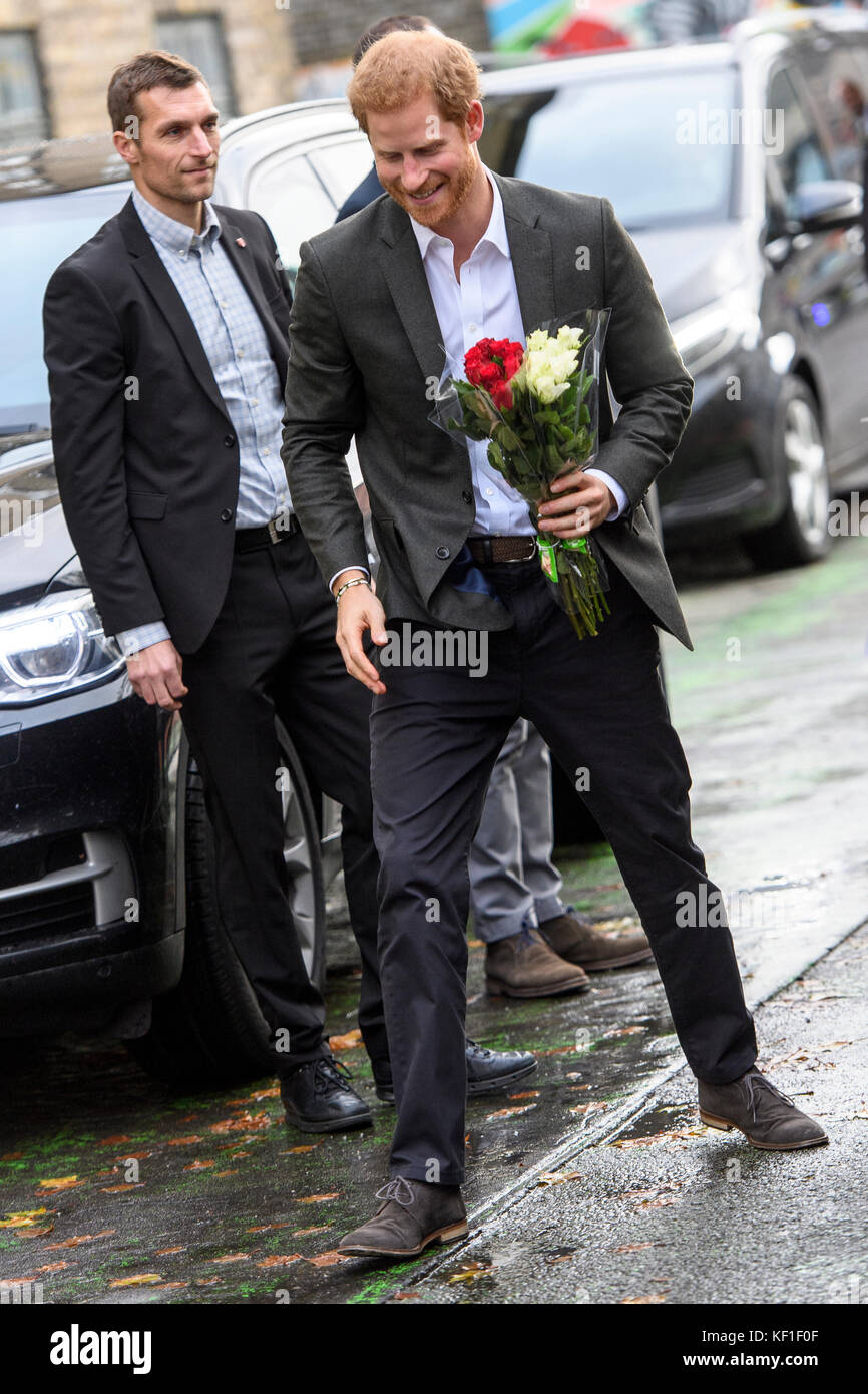 Copenhagen, Denmark. 25th October, 2017.HRH Prince Harry of Wales smiles after receiving  bouquets of flowers from supporters outside KPH Projects in Copenhagen. Harry paid a visit to the centre during a two-day official trip to the Danish capital. Credit: Matthew James Harrison / Alamy Live News Stock Photo